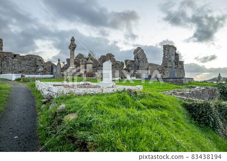 The sun is setting above the Abbey Graveyard which was build by Hugh O Donnell in 1474 - all names and artwork removed 83438194