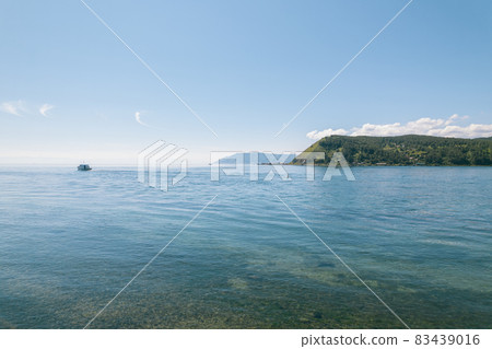 The Angara River is a major river in Siberia leaving Lake Baikal near the settlement of Listvyanka. Panoramic aerial view. The Angara River is a major river in Siberia leaving Lake Baikal near the settlement of Listvyanka. Panoramic aerial view. 83439016