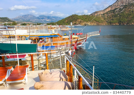People having fun at yacht on the shore of the cozy bay of Adrasan, near Antalya and Kemer, Turkey 83440779