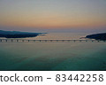 Kouri Island and Kouri Ohashi (northern part of the main island of Okinawa) dyed in the setting sun 83442258