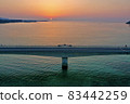 Kouri Island and Kouri Ohashi (northern part of the main island of Okinawa) dyed in the setting sun 83442259