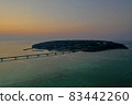Kouri Island and Kouri Ohashi (northern part of the main island of Okinawa) dyed in the setting sun 83442260