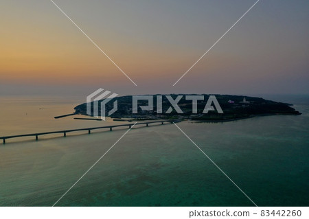 Kouri Island and Kouri Ohashi (northern part of the main island of Okinawa) dyed in the setting sun 83442260