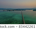 Kouri Island and Kouri Ohashi (northern part of the main island of Okinawa) dyed in the setting sun 83442261