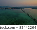 Kouri Island and Kouri Ohashi (northern part of the main island of Okinawa) dyed in the setting sun 83442264