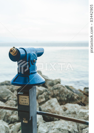 binocular at observation desk at sea beach 83442905
