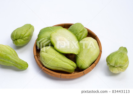 Fresh chayote fruit on white background. Fresh chayote fruit on white background. 83443113