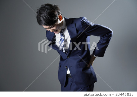 Businessman low back pain Businessman low back pain 83445033
