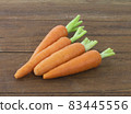 Carrot isolated on wood background 83445556