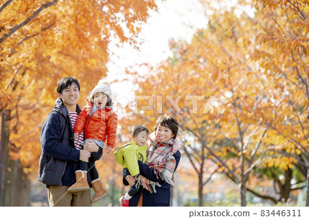 Four people walking in autumn park Four people walking in autumn park 83446311