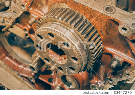 High Angle Zoom View of Crankshaft Gear in Front of Car Engine in Vintage Tone High Angle Zoom View of Crankshaft Gear in Front of Car Engine in Vintage Tone 83447270