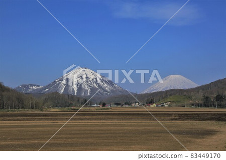 Mt. Shiribetsu and Mt. Yotei in spring (Kimobetsu Town, Hokkaido) 83449170
