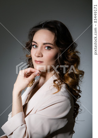 portrait of a smiling woman in profile. The caucasian face is covered with hair. The concept of skin care, natural cosmetics, Brazilian blowout, chemistry, painting with henna portrait of a smiling woman in profile. The caucasian face is covered with hair. The concept of skin care, natural cosmetics, Brazilian blowout, chemistry, painting with henna 83449171