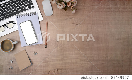 Top view mock up smart phone, notebook and laptop computer on wooden table. 83449907