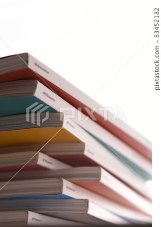 Randomly piled magazines 83452182