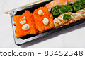 Japanese food called sushi . Rice rolls mixed with shrimp, salmon, and seaweed, food bar on white background. 83452348