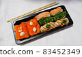 Japanese food called sushi . Rice rolls mixed with shrimp, salmon, and seaweed, food bar on white background. 83452349