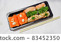 Japanese food called sushi . Rice rolls mixed with shrimp, salmon, and seaweed, food bar on white background. 83452350