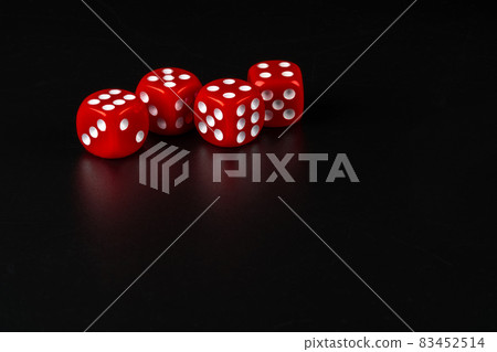 Group of dice close up on dark black background Group of dice close up on dark black background 83452514