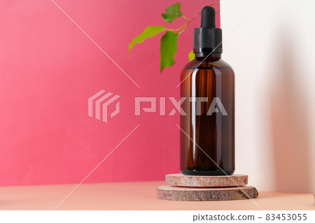 Brown glass cosmetic bottle. Organic cosmetic concept 83453055