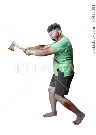 Scary zombie with blood and wound on his body holding ax standing Scary zombie with blood and wound on his body holding ax standing 83453391