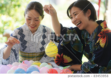 A woman enjoying yo-yo fishing 83453958