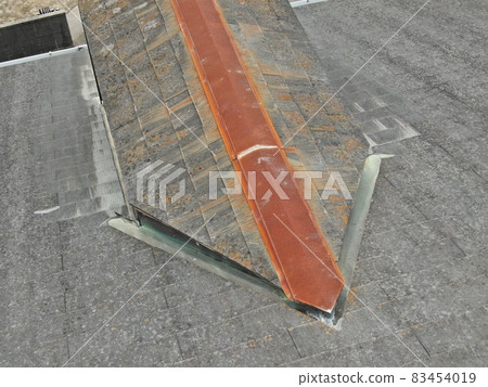 Pre-construction inspection photo taken by drone of the roof deterioration situation before painting the colonial roof of a detached house Pre-construction inspection photo taken by drone of the roof deterioration situation before painting the colonial roof of a detached house 83454019