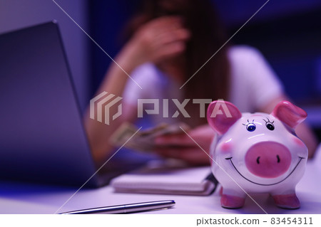 Female try to save up in moneybox Female try to save up in moneybox 83454311