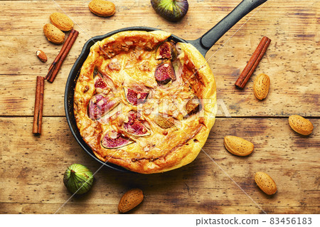 Omelet with figs in a frying pan 83456183