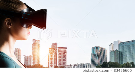 Young woman in VR goggles Young woman in VR goggles 83456600