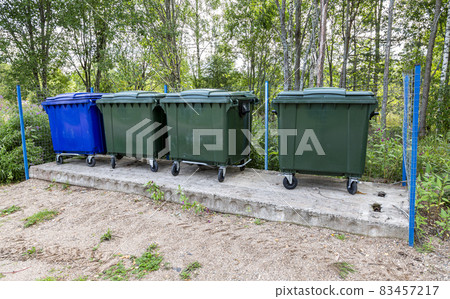 Plastic garbage containers at the outdoors Plastic garbage containers at the outdoors 83457217