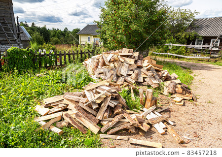 Chopped and stacked up dry firewood at the countryside Chopped and stacked up dry firewood at the countryside 83457218