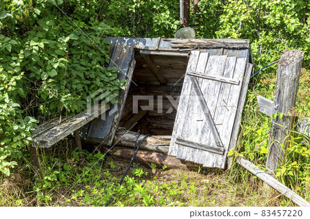 Wooden water well at the countryside in summer Wooden water well at the countryside in summer 83457220