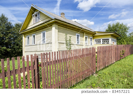 Old rural wooden house in russian village in summer 83457221