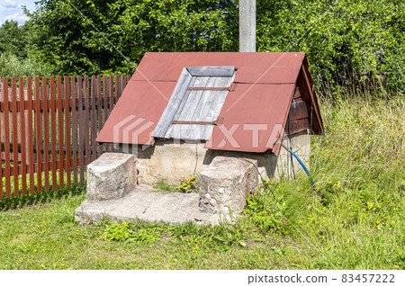 Wooden water well at the countryside in summer Wooden water well at the countryside in summer 83457222