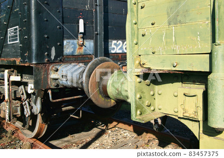 Old fashioned rusty railway freight train coupling buffers Old fashioned rusty railway freight train coupling buffers 83457375