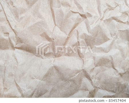 Crumpled wrinkled paper for background close up Crumpled wrinkled paper for background close up 83457404