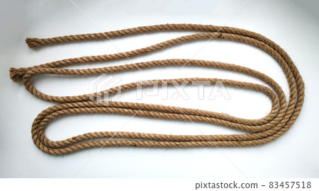 Rough natural rope cord on white background Rough natural rope cord on white background 83457518