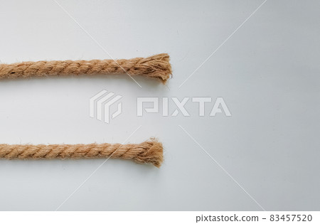 Rough natural rope strings on white background Rough natural rope strings on white background 83457520