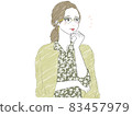 A woman thinking with her hands on her cheeks 83457979