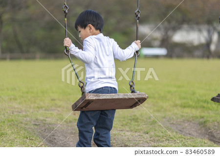 4-year-old boy on a swing 83460589