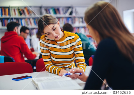 students group working on school project together on tablet computer at modern university students group working on school project together on tablet computer at modern university 83462626