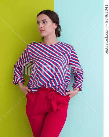 Portrait of young woman posing in the studio Portrait of young woman posing in the studio 83463041