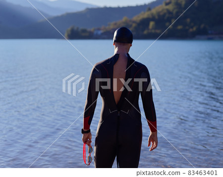 triathlete swimmer portrait wearing wetsuit on training triathlete swimmer portrait wearing wetsuit on training 83463401