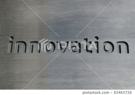 Engraving a cnc machine on a piece of metal. Engraving innovation text Engraving a cnc machine on a piece of metal. Engraving innovation text 83463726