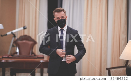 business man wearing protective face mask at office 83464212