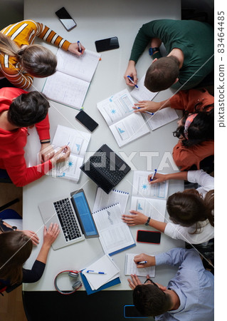 students use modern technology for a school project 83464485