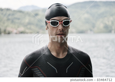 triathlete swimmer portrait wearing wetsuit on training 83464712