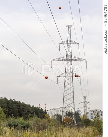 High towers of power transmission lines. Metal structures for providing electricity in suburbs. High towers of power transmission lines. Metal structures for providing electricity in suburbs. 83464783