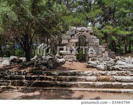 Ruins of ancient city Phaselis. Stones of damaged buildings. Agora of Domitian. Turkey. 83464794
